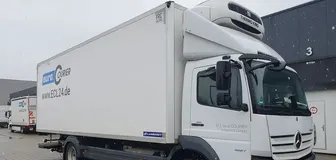 Box truck with refrigeration unit on the roof for deep-freeze tours through Germany.